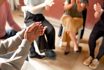 A group therapy session in a circle